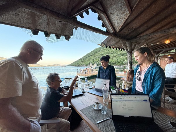 Restoration team discussing around a table at the Vrina Marshes